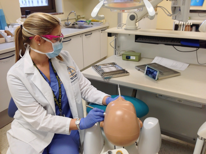 "Women working on a dummy"