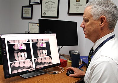 Dr. Kevin Pursel reviewing AI assessed radiograph